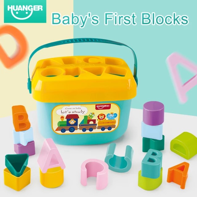 Toddler playing with colorful shape sorter educational toy