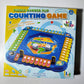Four children playing kids counting board game with number flip tiles