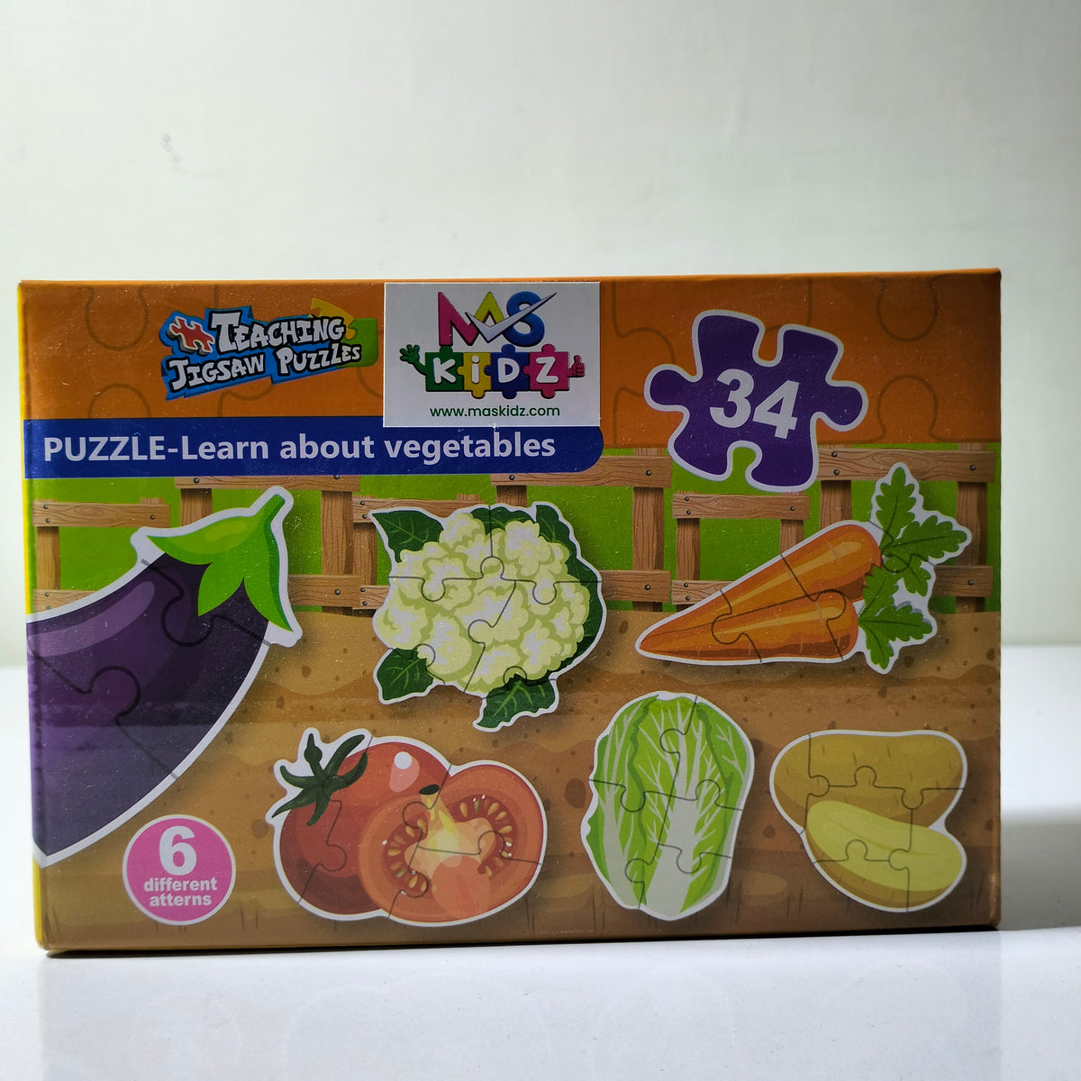 34 piece vegetable teaching jigsaw puzzle box showing carrot tomato cabbage cauliflower eggplant and potato